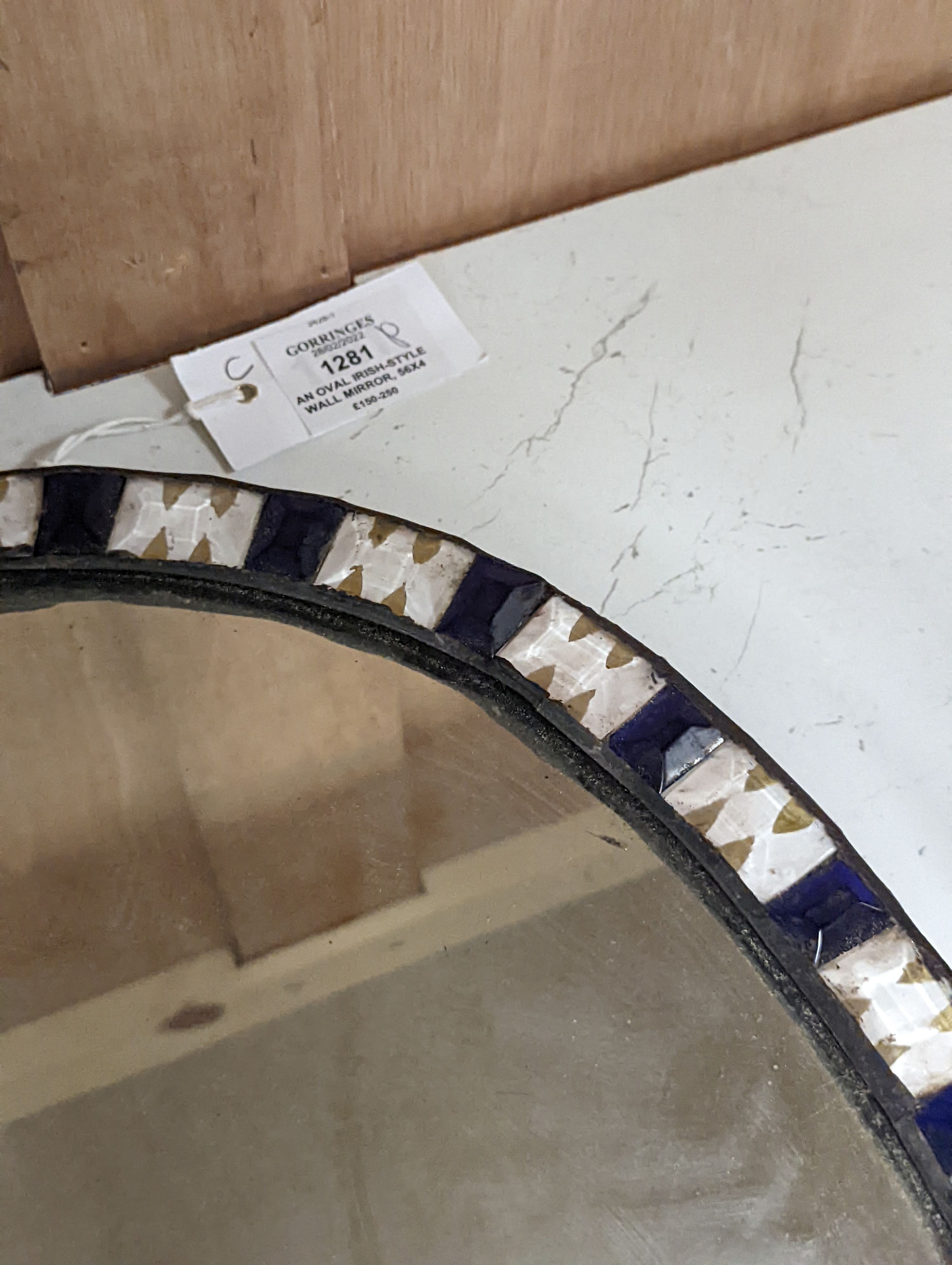 An oval Irish-style wall mirror, 56x41cm